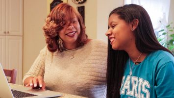 Tonisha Stills (left) clicks through photos from their trip to Paris with her daughter, Cimone. After struggling with severe epilepsy, Cimone was granted her wish of travelling to Paris, something her mom says not only gave her renewed hope, but helped reduce her seizures.