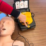 An AED is a lifesaving tool to diagnose and treat sudden cardiac arrest and is simpler to use than many people think. After turning on an AED, the machine guides users through each step, automatically assesses heart rhythm and will only deliver a shock if it is needed.
